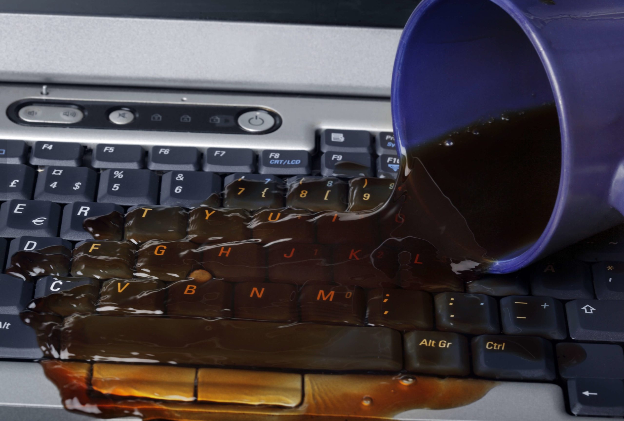 Coffee spilt on a laptop keuboard